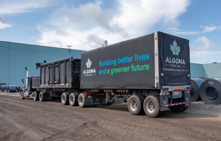 Algoma truck that says "building better lives and a greener future."