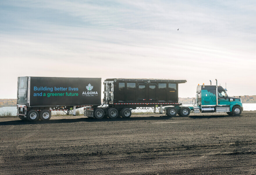 Algoma Steel's custom trailer driving across the steel plant