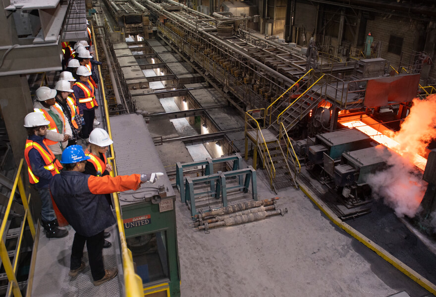 A group of Algoma Steel steel workers inside the steel mill.