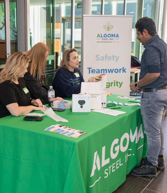 Algoma employees at a trade show booth.